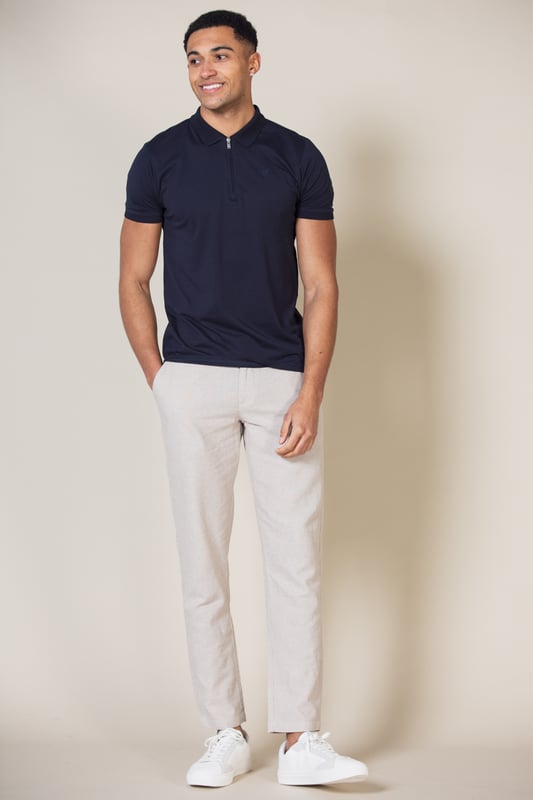 Stay stylish with this polo shirt by Nines Collection. This shirt is a classic design and features a zip fastening at the neck, knit detail collar and Nines branding on the chest. Made from 100% cotton pique fabric to ensure comfortable wear and easy care.