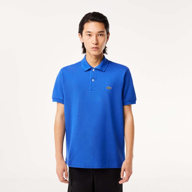 inchLacoste  inventor of the polo since 1933 Original L.12.12 Polo. Made by Lacoste. The Icon. Collar  button placket  petit piqué fabric - these are the components thought by René Lacoste. Yes  René did it first. 90 years ago  he challenged the status quo by creating the first polo to bring more freedom of movement on and off court. And put a crocodile at heart  making Lacoste the first brand who put a logo on clothing. Classic fit  comfortable ease on body and sleeves Original L.12.12 polo in our iconic petit pique renewed every season in a new large color palette. The Petit Piqué fabric is a Lacoste signature. It made of fibers knit together at two different levels of tension. The result? A finely honeycombed fabric that enables air to circulate freely. This fabric ensures comfort  ease of movement and elegance. Ribbed collar and cuffs Side slits Invisible hem Real mother of pearl buttons 3cm green crocodile at chest inch.
