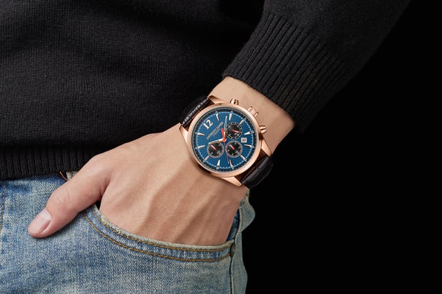 A fantastic addition to any wardrobe, this Hand Assembled Anthony James  Classic Chronograph Rose Blue men’s watch uses Quartz movement for the rose gold minute and hour hands and the three chrono eyes for exceptional precision. These are set against a midnight blue dial and complemented by rose gold markers and the rose gold alloy case that includes round pushers for straightforward adjustability. The ink-black genuine leather strap with pin buckle fits perfectly into the case which is secured on the reverse by a 304 stainless steel caseback with dependable snap-in construction for assured wear whether at home or out of the house
Quartz movement PE902.
Alloy case
 Round pushers
3ATM Water resistant. 
304 stainless steel caseback with snap-in
construction.
 Front mineral lens.
 Blue dial with 3 chrono eyes.
 Rosegold hour/minute hands. 
Black genuine leather strap with pin buckle. Rosegold flash plating

Watch Dimensions:
Case Diameter- 43 mm
Case Thickness- 10.8 mm
Lug width- 22.1 mm
Strap width- 22 mm
Strap length- 195 mm
Weight- 50 grams