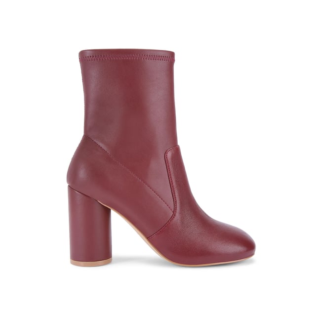 This Langley Round Ankle Boot features a wine upper crafted from a soft leather. The heel is rounded matching the toe shape. Heel height: 9cm.