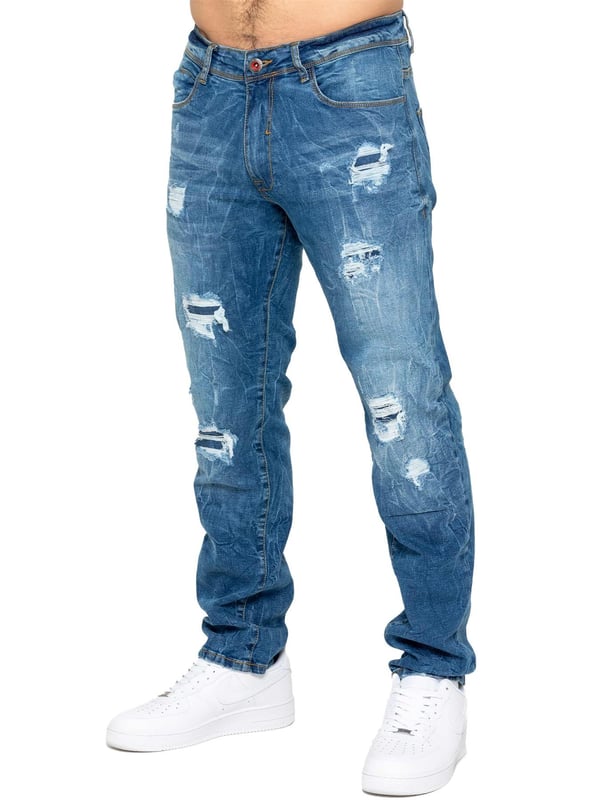 Mejora tu colección de denim con los Enzo Men's Distressed Ripped Jeans. Diseñados para el hombre moderno, estos jeans combinan estilo y comodidad con un corte clásico de pierna recta y un diseño versátil de 5 bolsillos. La tela elástica asegura un ajuste perfecto y máxima comodidad, permitiéndote moverte con facilidad durante todo el día. Con cierre de cremallera, detalles desgastados y un parche trasero de la marca, estos jeans añaden un toque rudo y elegante a tu atuendo. Perfectos para salidas casuales o una noche fuera, los Enzo Men's Distressed Ripped Jeans combinan estilo y funcionalidad sin esfuerzo.