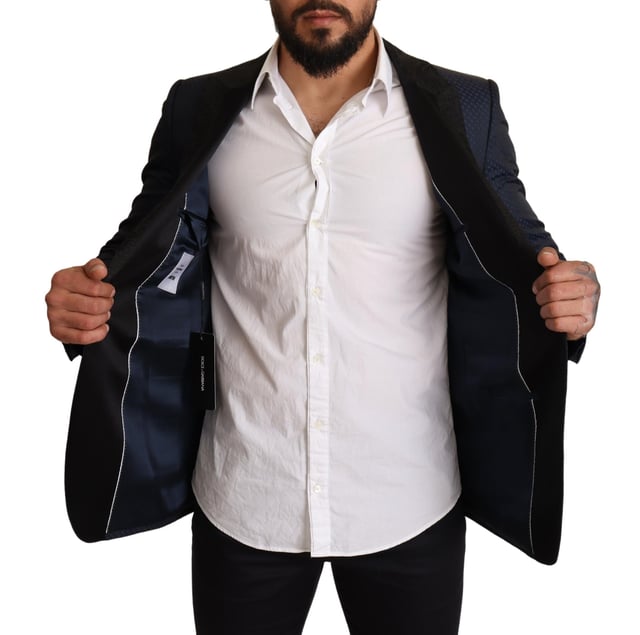 Stunning Dolce & Gabbana MARTINI Slim Fit Blazer Jacket
  Single breasted one-button style
  Slim fit for a great fitting and comfort
  Beautiful blue color
  Three outside pockets and two inside pockets
  One open vent in the back for breathability
  Logo details for a signature touch
  Made in Italy with premium materials
  Material: 6% AC 50% PL 11% Silk 33% Wool
  Lining: 100% Silk
Material: 6% AC 50% PL 11% Silk 33% Wool