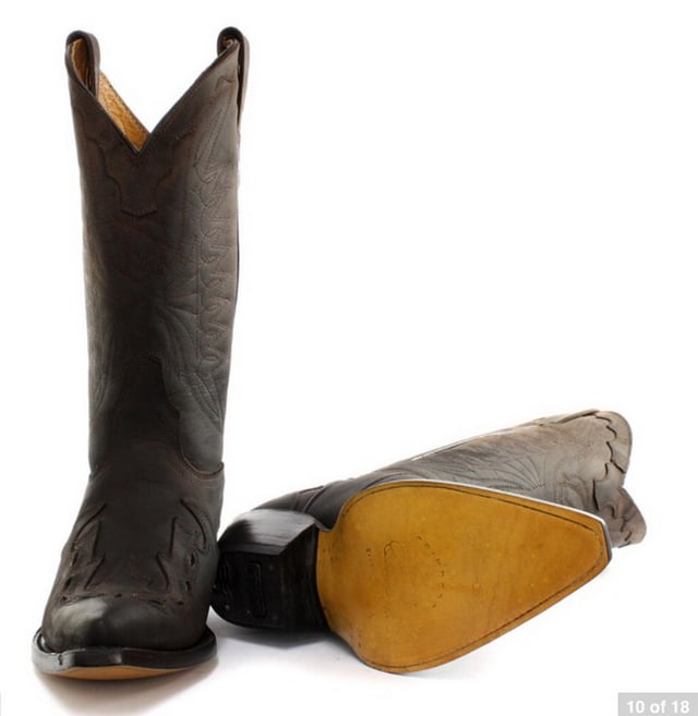 Featuring hand crafted premium leather on the brown upper and on the inner lining, this pair of boots offers a great amount of style and comfort. A high-quality detailed pattern is stitched on to the upper and a 1.5” stacked Cuban heel is introduced to compliment the high boot design. This boot was manufactured with a Grinders proprietary sole unit, that has been heat bonded to the welt using the Goodyear method, which is known for increasing the strength of the boot and ensuring durability for years to come. The sole is also fitted with a unique air cushion that allows for added flexibility and which adds to the long-lasting qualities of this boot. • Oily black leather upper • Goodyear Welted sole unit • Luxurious interior leather lining • Stacked 1.5” leather heels • Leather Soles • Made in Mexico