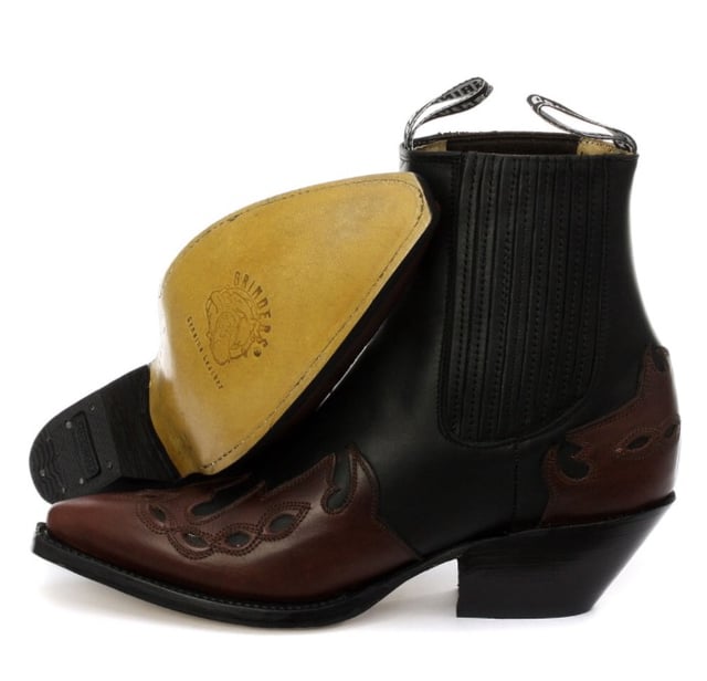 This boot is a shorter version of the Grinders ‘Arizona’ cowboy style and has been reimagined in a classic Cuban heeled Chelsea boot. The upper is made of high-quality leather and a stylish leather overlay appears on the pointed toe with a convenient elasticated gusset and pull loops implemented at the boot opening. The interior is crafted from soft leather which cushions the foot and allows for breathability. The underside of the shoe displays a stacked 1.5” heel which is built onto a durable welted leather sole that has been engraved with the iconic Grinders Bulldog logo. • Goodyear Welted • Leather upper • Soft Leather lining • Stacked leather heels • Leather Soles • Made in Mexico