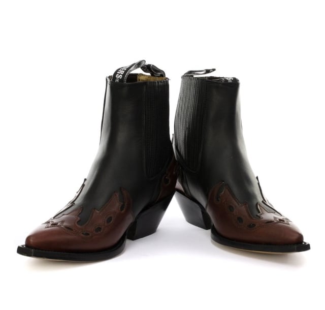 This boot is a shorter version of the Grinders ‘Arizona’ cowboy style and has been reimagined in a classic Cuban heeled Chelsea boot. The upper is made of high-quality leather and a stylish leather overlay appears on the pointed toe with a convenient elasticated gusset and pull loops implemented at the boot opening. The interior is crafted from soft leather which cushions the foot and allows for breathability. The underside of the shoe displays a stacked 1.5” heel which is built onto a durable welted leather sole that has been engraved with the iconic Grinders Bulldog logo. • Goodyear Welted • Leather upper • Soft Leather lining • Stacked leather heels • Leather Soles • Made in Mexico