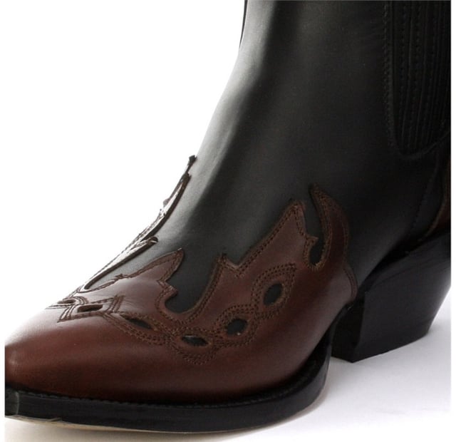 This boot is a shorter version of the Grinders ‘Arizona’ cowboy style and has been reimagined in a classic Cuban heeled Chelsea boot. The upper is made of high-quality leather and a stylish leather overlay appears on the pointed toe with a convenient elasticated gusset and pull loops implemented at the boot opening. The interior is crafted from soft leather which cushions the foot and allows for breathability. The underside of the shoe displays a stacked 1.5” heel which is built onto a durable welted leather sole that has been engraved with the iconic Grinders Bulldog logo. • Goodyear Welted • Leather upper • Soft Leather lining • Stacked leather heels • Leather Soles • Made in Mexico