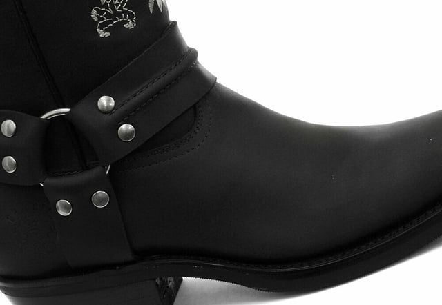This bald eagle style pairs a vintage cowboy silhouette with an eye-catching design and imparts it upon a hard wearing and durable boot. The boot upper is crafted from leather and is embossed with a colour contrasting embroidered eagle design which is stitched onto the front and back. Additionally, a three-way ankle harness with riveted brass rings is wrapped around the boot and imbues it with extra unique quality. Other introductions to this shoe include a square toe front, comfortable leather lining, a stacked 1.5” Cuban heel and embossed branding on the outer sides. For an added durable quality, the sole of this boot is welted using the Goodyear method, which is known for providing strength and long last to shoes. • High Leg Harness Boots • Goodyear Welted sole • Shoe upper is crafted from premium leather • Features a soft leather lining • Rubber soles • Made in Mexico