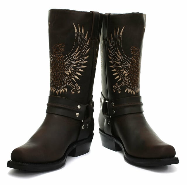 This bald eagle style pairs a vintage cowboy silhouette with an eye-catching design and imparts it upon a hard wearing and durable boot. The boot upper is crafted from leather and is embossed with a colour contrasting embroidered eagle design which is stitched onto the front and back. Additionally, a three-way ankle harness with riveted brass rings is wrapped around the boot and imbues it with extra unique quality. Other introductions to this shoe include a square toe front, comfortable leather lining, a stacked 1.5” Cuban heel and embossed branding on the outer sides. For an added durable quality, the sole of this boot is welted using the Goodyear method, which is known for providing strength and long last to shoes. • High Leg Harness Boots • Goodyear Welted sole • Shoe upper is crafted from premium leather • Features a soft leather lining • Rubber soles • Made in Mexico