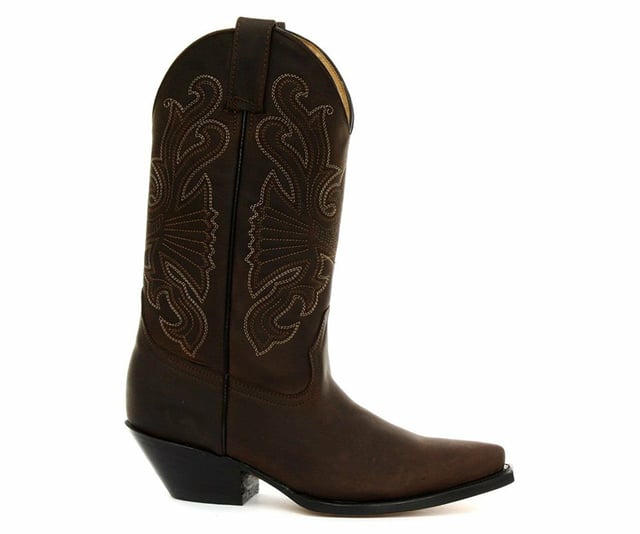 The Grinders Buffalo is a quality, hard wearing all leather western cowboy boot. This style features a brown oiled upper which is abrasion resistant for longer wear and sports a colour contrasting stitched detailed pattern on the shaft. This boot is given an iconic Western style with introductions such as a pointed toe and 2.25-inch stacked Cuban heel and is made comfortable using a full leather lining and insole. The branded genuine leather sole unit provides greater durability and the two side pull on loops makes the boots easier to put on, all of which add to the comfort and practicality of this stylish luxury Buffalo boot. • Goodyear Welted sole • Leather upper with detailed stitched design • Soft Leather lining • Stacked 2.25” Cuban heels • Leather Soles • Made in Mexico
