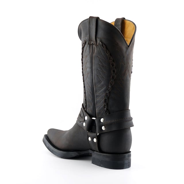 These calf length boots feature a decorative weaved pattern which is stitched onto the upper panel giving this piece a great distinctive character. Additionally, the boot features a sophisticated pointed two as well as 1.5” heels and an additional two pull loops at the sides for easy slip on. This boot was manufactured with a grippy rubber outsole, that has been heat bonded to the welt using the Goodyear method, which is known for increasing the strength of the boot and ensuring durability for years to come. The sole is also fitted with a unique air cushion that allows for added flexibility and which adds to the long-lasting qualities of this boot. • Goodyear Welted • Leather upper • Two pull loops to sides for easy slip on • Luxurious interior leather lining • Rubber Soles • Made in Mexico