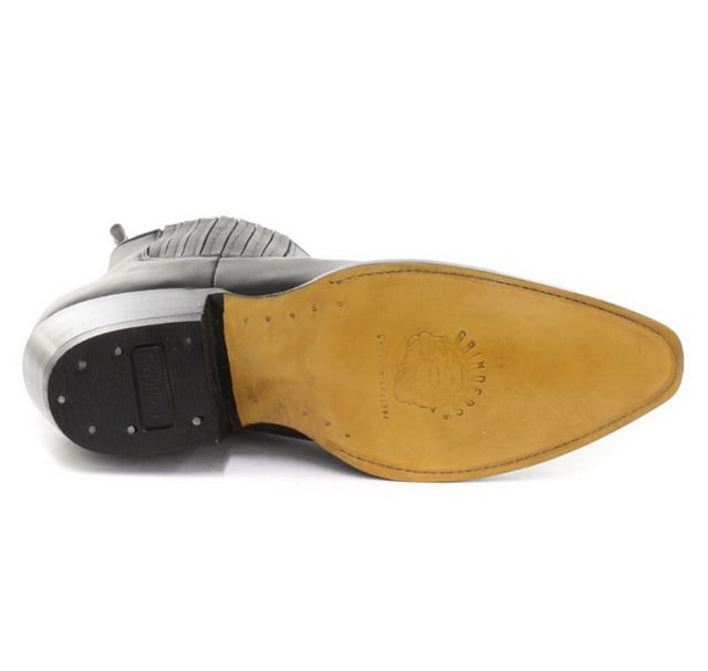 This pair of western ankle boots features entirely in leather for a sophisticated look and feel, the upper is made abrasion resistant for long lasting durability and for added character we feature intricately stitched detail on the front. The front of the shoe is completed with a pointed toe front, and the sides feature an elasticated top line as well as two branded pull-on loops for easy wear. The sole unit of this shoe is branded with the Grinders Bulldog and has been heat bonded to a welt to give this shoe additional strength and durability. • Goodyear Welted • Leather upper • Soft Leather lining • Stacked leather heels • Leather Soles • Made in Mexico
