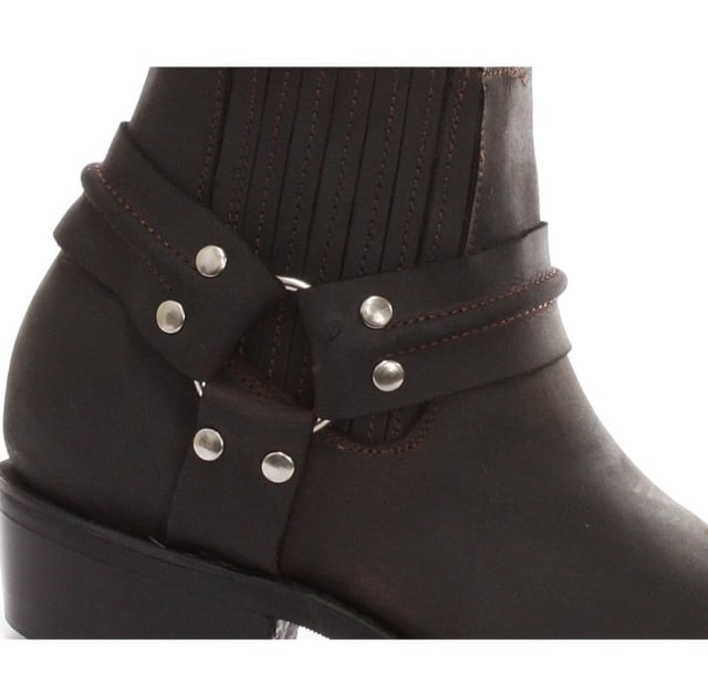 This classy leather boot appears in a low leg silhouette and features a stud detailed tri harness design that wraps around the boot and is connected by a metal ring. The slip-on design of these shoes is enhanced by the use of branded pull-on loops and stitched twin side elasticated gussets that make these boots easy to get on and off. For an added durable quality, the sole of this boot is welted using the Goodyear method, which is known for providing strength and long last to shoes. • Low Leg Harness Boots • Goodyear Welted sole • Shoe upper is crafted from premium leather • Features a soft leather lining • Rubber soles • Made in Mexico