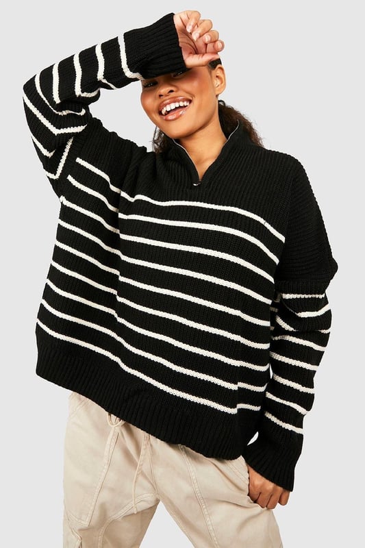 Half-zip neckline for adjustable coverage
        Bold striped pattern for eye-catching style
        Relaxed, oversized fit for ultimate comfort
        Ribbed cuffs and hem for a snug finish
        Versatile design suitable for various casual occasions
    
    Make a statement in this striking striped jumper, perfect for the fashion-forward petite woman. The half-zip neckline adds a sporty touch while allowing you to customise your look. Its relaxed, oversized silhouette offers both style and comfort, ideal for those laid-back days when you want to look effortlessly chic. Pair it with wide-leg trousers and trainers for a trendy casual ensemble, or throw it over a midi skirt and ankle boots for a more put-together look. Whether you're meeting friends for coffee or heading to a family gathering, this jumper is your go-to piece for versatile, on-trend style. The bold stripes and cosy knit fabric make it a standout item in your wardrobe, ready to take you from season to season with ease.