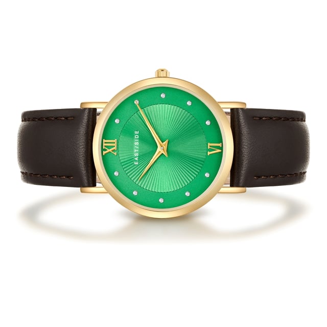 GENERAL INFORMATION:  • Targetgroup: Female  • Wristwatch: No Special Functions  • Display: analogue  • Weight of watch w/o box (gr.) - approx.: 26,0  MOVEMENT:  • Movement: Quartz  • Term of Movement: 2025  • Origin of movement: Japan  BRACELET:  • Material of bracelet/strap: Genuine leather  • Plating of bracelet/strap: None  • Finishing of bracelet/strap: Smooth  • Finishing/Decoration of bracelet/strap: Seam  • Clasp/Closure/Buckle: Buckle  • Color of bracelet/strap: Dark brown  • Length of bracelet/strap (mm) approx.: 210,0  • Width of bracelet/strap (mm) approx.: 18,0  • Style/Design of bracelet/strap: No imprint  • Bracelet/strap adjustable?: No  CASE:  • Shape of case: Round  • Size/Diameter of case in mm . approx.: 33,0  • Height of case in mm: 6,7  • Case material: Metal (Alloy)  • Surface of case: Polished  • Bezel/Topring: Fixed  • Finishing/Decoration of case: None  • Material of case back: Stainless steel  • Lock of case back: No screwed-in crown  • Color of case: Yellowgold  • Coating/Plating (Case): Ion-Plating (IP)  • Type/Form of crystal: Flat  • Material of crystal: Mineral crystal  • Water resistant (ATM): 3  DIAL:  • Size jewelry care cloth: Hour, Minute  • Indices: Roman numerals/points  • Material of dial: Brass  • Structure/pattern of dial: sunray  • Color of dial: Green  PUSHER, CROWN, HAND:  • Pusher: None  • Corrector: No  • Crown: No screwed-in crown  • Type of hands: Dauphine hands  • Luminescent (hands): No  PACKAGING & SCOPE OF DELIVERY:  • Box: Yes  • Service booklet: Yes  • Manual: Yes