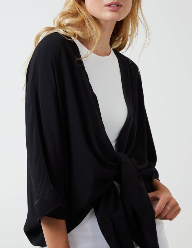 This top is a must have in your holiday suitcase. This stunning, simple top is perfect for a holiday cover up.