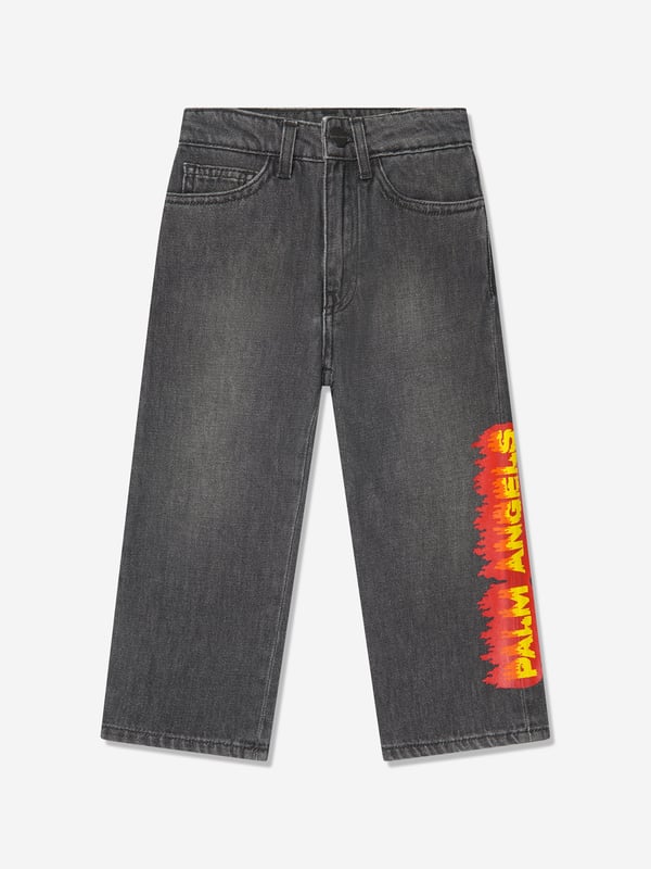 Palm Angels combine Italian craftsmanship with enigmatic Californian imagery. These boys black jeans are reflective of the label's passion for daring fits with an innovative twist. Depicted in a five-pocket denim design with a special 'Palm Angels' "Flames" print in orange, yellow and red on the left leg.  Regular Ft Wide Leg Fabric: 100% Cotton Lining: 65% Cotton, 35% Polyester