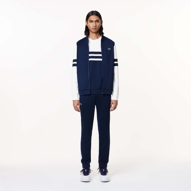 Designed for Tennis  for a regular frequency of use This product is in Interlock which guarantees you a resistant fabric making it adapted to high repetitive movements during training sessions. This sweatshirt is made in 100% recycled polyester Classic fit: comfortable ease on body  with comfortable sleeves The technical capsule offers the complete seasonal wardrobe on and off court with a strong design identity. LACOSTE wording print at back neckline.
