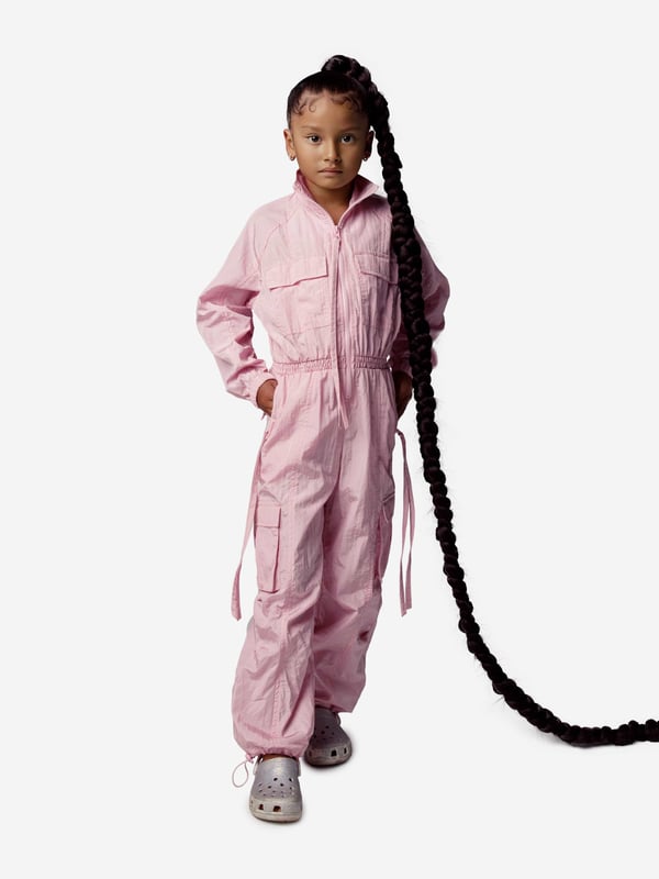 Dream big and feel fab with this girls pink woven jumpsuit from AY by Ayla. The stylish and dramatic piece is a lightweight overall designed to look good with every move. Dance, jump and twirl with effect thanks to an on-trend aesthetic straight out of a music video. Wear over light layers for a cool and chic look. Front Zip Fastening Elasticated Cuffs Elasticated Waistband Elasticated Toggle Ankle Cuffs 2 Side Zip Pockets 2 Chest Pockets 2 Cargo Pockets 2 Back Pockets