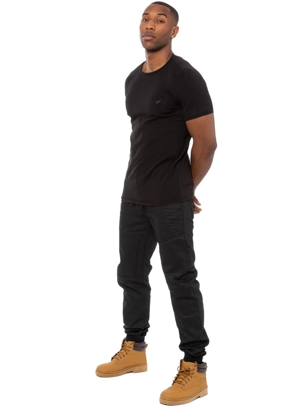 Enzo Mens Cuffed jogger jeans. Printed branding on the front and back. Branded buttons, rivets and trimmings. Overall profile stitched, creasing on front and back. Cotton blend, Cut and sew panelling. Waist adjustable drawstrings.