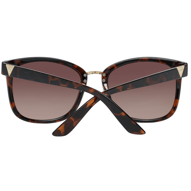Guess Square Womenss Brown Brown Gradient GF0327  Sunglasses are a modern square frame shape, exuding a sense of timeless elegance. The frame is crafted from high-quality acetate, known for its durability and lightweight feel, ensuring long-lasting comfort throughout the day. Slender temples feature the Guess logo for a touch of sophistication.