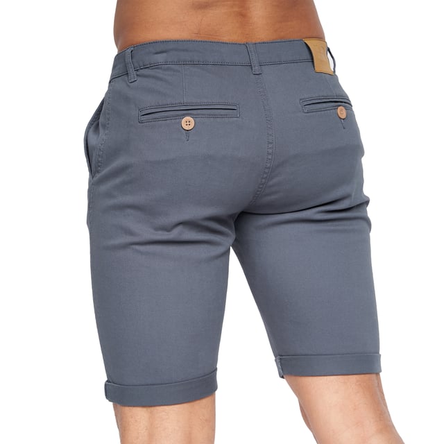 98% Polyester, 2% Elastane. Fabric: Canvas, Stretch. Design: Logo. Pockets: 2 Side Pockets, 2 Back Pockets, Jet Pocket, Buttoned. Fastening: Button, Zip Fly. Style: Chinos. Back Yoke, Belt Loops, Darted, Gripping Inner Waistband, Mock Horn Buttons, Self Fabric, Twin Needle Stitch.