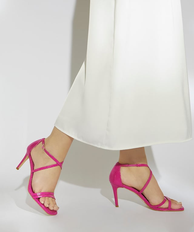 Dune Ladies Musical - Square Toe High Heel Sandals Make a subtle style statement in our elegant square toe high heel design. Resting on a stiletto heel and secured in place with an adjustable ankle strap these wide fit open toe sandals will be a versatile addition to your heel repertoire.