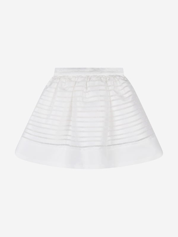 Mama Luma's sophisticated portfolio takes inspiration from a bygone era. This girls white strap skirt is both captivating and beautifully constructed. Crafted in a polka-dot bobbled effect via a chiffon effect on a peplum hem. It is complete with a tie-up bow and satin stripe trim. She will embody unparalleled confidence.  Mesh/Cotton Lining  100% Polyester