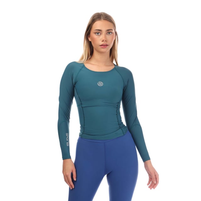 Womens Skins Series-3 Long Sleeve Top in teal.- Round neck.- Long sleeves.- Mesh panelling.- Reflective logo.- 76% Nylon  24% Elastane.- Ref: ST40300050574