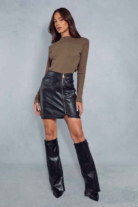 Ribbed fabric with textured detail 
 Long sleeves with fitted cuffs 
 Asymmetrical hemline for modern edge 
 Seam detailing adds visual interest 

This on-trend ribbed top from Misspap features an asymmetrical hem and seam detailing for a modern look. The ribbed fabric hugs the figure, while the long sleeves with fitted cuffs ensure a sleek silhouette. Pair this top with your favourite jeans or trousers for an effortlessly chic daytime look. For nighttime, dress it up with heels, a leather skirt and bold accessories for cocktails or a girl's night out. The versatile solid hue allows for creative mixing and matching with prints, patterns and colours.