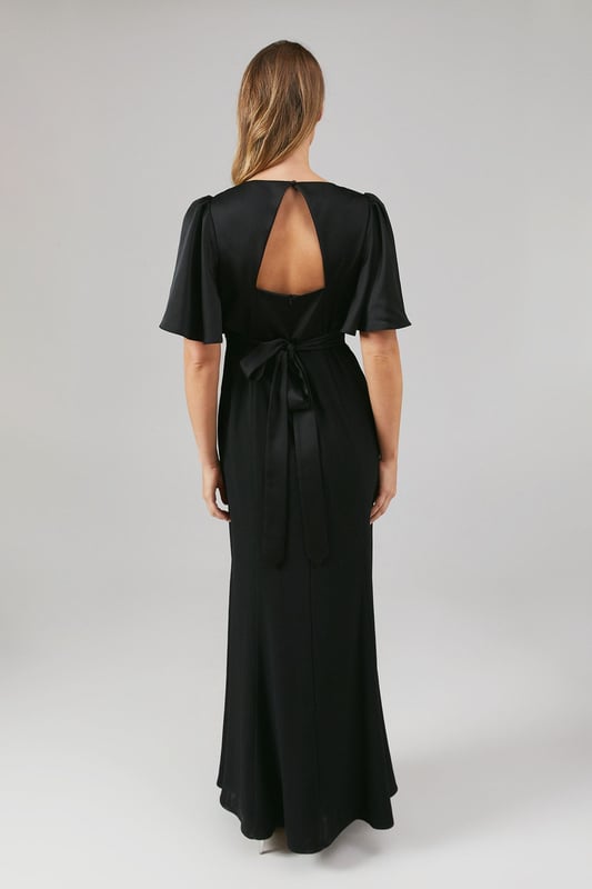 Elegant V-neckline for a flattering silhouette
        Graceful angel sleeves add a touch of romance
        Striking open back design with tie detail
        Floor-length skirt for a sophisticated look
        Luxurious satin fabric for a polished finish
    
    This stunning bridesmaids dress from Coast is the epitome of elegance and grace. Perfect for your role in the bridal party, this gown combines classic sophistication with modern details. The V-neckline and angel sleeves create a romantic silhouette, while the open back with tie detail adds a contemporary twist. The floor-length skirt ensures a refined look as you walk down the aisle. Crafted from sumptuous satin, this dress drapes beautifully and catches the light in all the right ways. Pair with delicate jewellery and strappy heels to complete your bridesmaid ensemble. Whether you're standing beside the bride or dancing the night away at the reception, this dress will ensure you look and feel fabulous throughout the wedding celebrations.