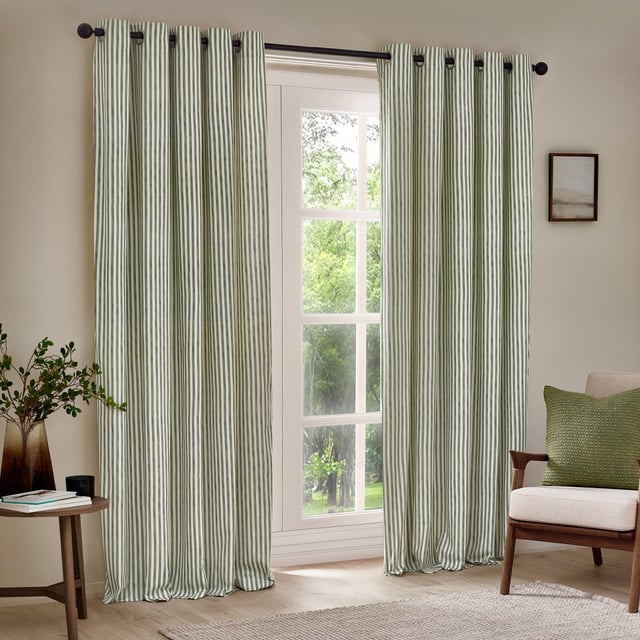 Transform your living space with Hebden Striped Eyelet Curtains. Crafted from 100% cotton, these woven striped curtains offer a super soft yet durable finish, ensuring long-lasting beauty and ease. Perfectly balancing style and substance, the versatile design exudes a classic minimalist charm, while the room-darkening lining adds practicality. Whether you're seeking serenity or a restful night’s sleep, these curtains deliver quality, making them an essential addition for those who cherish natural materials and refined aesthetics.