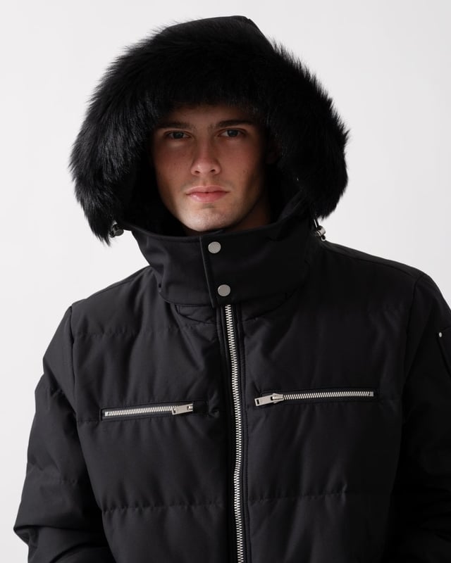 The Cloud Bomber boasts a 30% weight reduction compared to Moose Knuckles Originals, providing lasting warmth without added bulk. Crafted from lightweight shell and RDS-certified 90/10 down fill, it features a hollow frame logo for maximum warmth in a lightweight package. Its removable lamb shearling-trimmed hood adds versatility, while heat-retaining brushed pockets at the front enhance functionality.


Warmth & Protection


Protection Rating - Level 3: Crazy Cold – Heavy and durable, choose these garments when the cold gets serious.
800 Fill Power
Toscana Shearling on Trim
Water Repellent, Water Resistant, Wind Resistant




Design & Function


Capuchon amovible
Down Filled Collar
2- Way Zipper with Logo Puller
2 Pockets with Zipper Closure on Chest2 Pockets with Zipper Closure below Waist
Rib Knit Cuffs and Hem
Black Nickle Metal Logo


COMPOSITION



Body: 100% Polyester
Lining: 100% Polyester


FILL

90% Duck Down 10% Feathers
 
M34MB005S


 



 



 