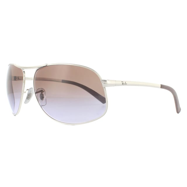 Las gafas de sol Ray-Ban RB3387 003/68 Silver Brown Gradient son una versión más grande de las clásicas gafas de piloto Ray-Ban. Estas tienen un brazo mucho más ancho con la clásica forma de aviador.