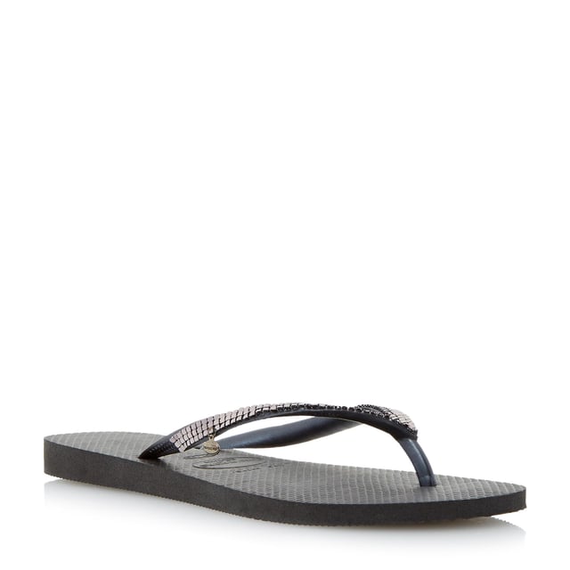Add some sparkle to your summer style with this metallic mesh flip flop. A classic toe post style with slim straps and miniature branded coin charm.