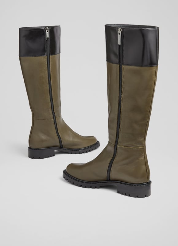 LK Bennett Lincoln Knee Boots, Army Green A knee-high boot with a biker feel, our Lincoln flat boots are a brand-new style in our autumn/winter collection. Crafted in Italy from super-soft army green calf leather, they have a round toe, a contrast border in black, an inside zip and a rugged, chunky flat sole. Wear them to dress down winter dresses or with jeans on more casual days.