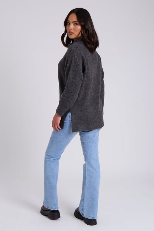 Model is 5'6 and wears a size 8. Introducing our effortlessly chic and comfortable&nbsp;Charcoal Plain Oversized Half Zip a versatile addition to your wardrobe that combines style with ease. This Sweater is designed for those who want a perfect balance between fashion-forward flair and laid-back comfort.  Crafted with utmost attention to detail, the&nbsp;Charcoal Plain Oversized Half Zip boasts a relaxed and flattering oversized fit that drapes elegantly, providing a cosy and stylish look for any occasion. Its soothing creates a sense of sophistication, making it a timeless piece that can effortlessly transition from season to season.