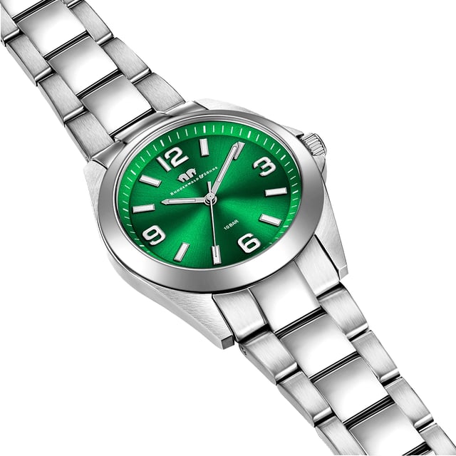 Do you love watches with timeless design in connection with your own character and exclusive quality? Then this women's watch from the Rhodenwald & Sons brand is the perfect choice. The clock manufacturer stands for stylish and sustainable masterpieces for all generations: the timepiece enthusiastic with a brave dial color, minimalist line indices, Arabic numbers, minute and luminiscant staff. The robust stainless steel housing and a suitable link bracelet made of stainless steel fit harmoniously into the overall concept. A precise quartz clock, a screwed housing floor and waterproof up to 10 ATM round off the high-quality equipment and make the watch an Every Day Piece.