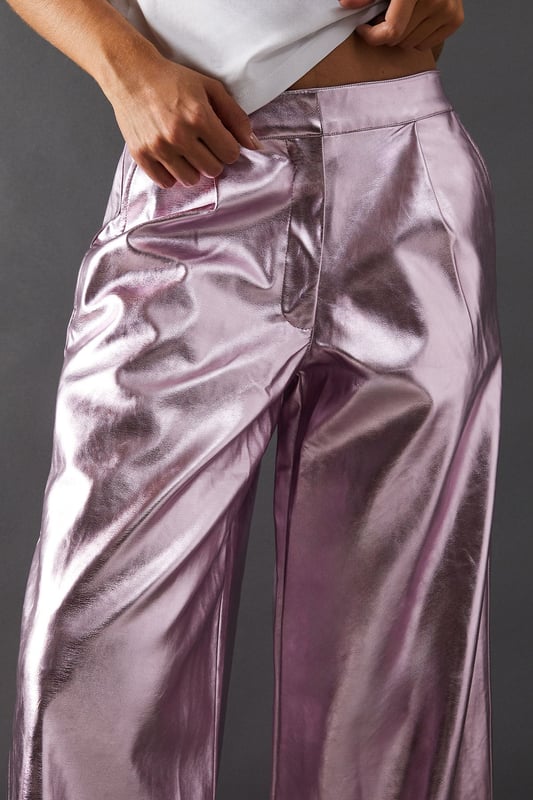 Eye-catching metallic finish for a bold statement
        Wide leg silhouette for a comfortable and trendy fit
        High-waisted design accentuates the waistline
        Front zip and button fastening for a secure fit
        Versatile style suitable for various occasions
    
    Make a dazzling entrance with these striking metallic wide leg jeans from Warehouse. Perfect for those who dare to stand out, these trousers combine comfort with high-impact style. The wide leg cut offers freedom of movement while creating a fashionable silhouette. For a night out on the town, pair these show-stopping trousers with a crisp white shirt, leaving it partially unbuttoned for a relaxed yet chic look. Add some platform sandals to elongate your legs and complete the ensemble with statement earrings. Whether you're hitting the dance floor or enjoying drinks with friends, these jeans will ensure you're the centre of attention. Their versatility also allows for more casual styling - try pairing with a simple black tee and trainers for an effortlessly cool daytime look that transitions seamlessly into evening wear.