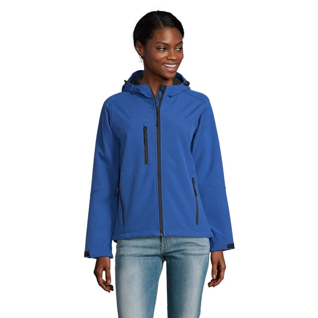 Breathable, windproof and water resistant. Shaped fit. Taped neckline. Hood with adjustable drawcord. Collar high full zip with inner storm flap and chin guard. Two front zip pockets and one right chest zip pocket. Tear release adjustable cuffs. Adjustable drawcord at hem. Drop tail. Access for decoration. Material: Stretch soft shell fabric has a 94% polyester/6% elastane outer, membrane and polyester fleece backing. Ladies size: S(8/10), M(12), L(14), XL(16), XXL(18).