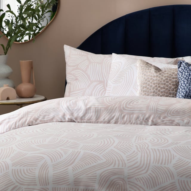 Enjoy a comfortable night’s sleep in the Dunes duvet cover set, inspired by modern, minimalist and abstract art. It features an intricately swirling, abstract line printed design, reminiscent of drifting sand dunes. The reverse reveals an inverted colourway for a more defined look, making it ideal for a midweek refresh if desired. A simple and timeless addition to your bedding collection. This product is certified by OEKO-TEX® showing it has been sustainably made.