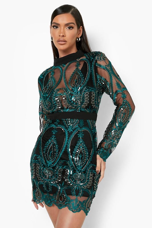Stunning sequin damask pattern for eye-catching glamour
        Figure-flattering cupped design enhances silhouette
        High neck adds a touch of sophistication
        Long sleeves provide elegant coverage
        Mini length perfect for showcasing legs
    
    Make a dazzling entrance at your next festive celebration with this show-stopping sequin damask mini dress from Boohoo. The intricate pattern catches the light beautifully, ensuring you'll shine all night long. The cupped design and high neckline create a flattering silhouette, while the mini length allows you to flaunt your legs with confidence. Style with strappy heels and a clutch bag for a chic Christmas party look. For a more relaxed Christmas Day outfit, layer over opaque tights and pair with ankle boots. This versatile piece can be dressed up or down, making it a must-have addition to your holiday wardrobe. The long sleeves offer a balance of coverage and allure, perfect for those cooler winter evenings.