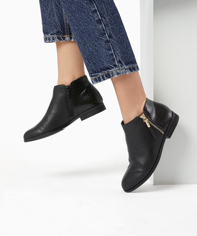 It's all about the subtle detailing on our Pandie ankle boots. Featuring an exposed gold hardware zip with a leather pull and a contrasting moc snake panel on the ankle. Seriously chic and effortlessly stylish.