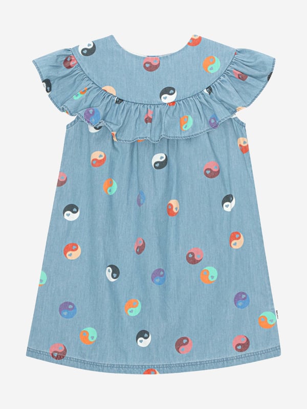 Molo encapsulate fierce energy and creative ambition in their sustainability abstracts. This girls Ying  Yang dress is envisioned in soft beautiful cotton via a multi-coloured perspective. It showcases a yoke at the neck with a ruffle edge, which goes all the way around the neck and forms the short sleeves.  Loose Fit Small Button Closure Denim Look 100% Cotton