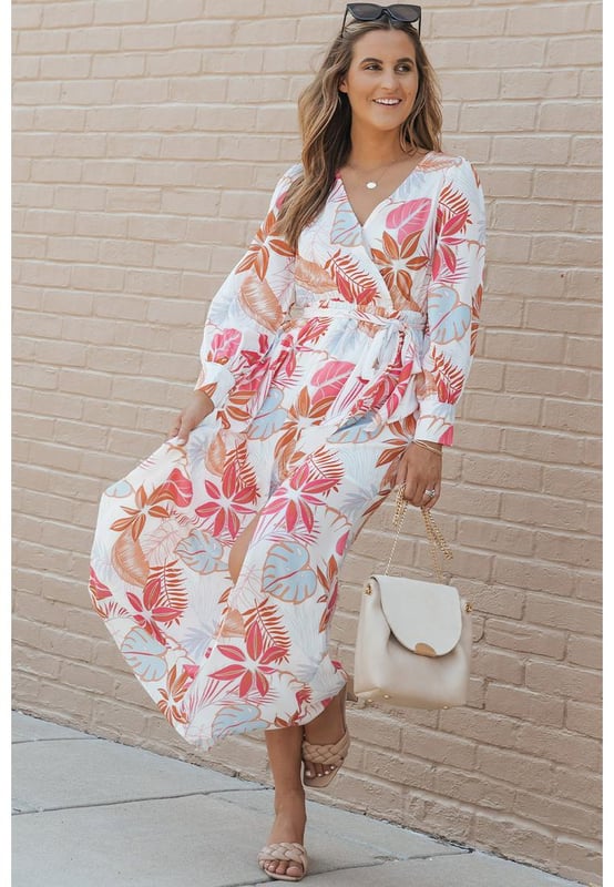 Tropical plant print adds a touch of nature
  Long sleeves provide coverage
  Wrap design and V-neckline create a flattering silhouette
  Slit detail adds a hint of allure
  Made from Quality materials
  Suitable for both casual and formal occasions