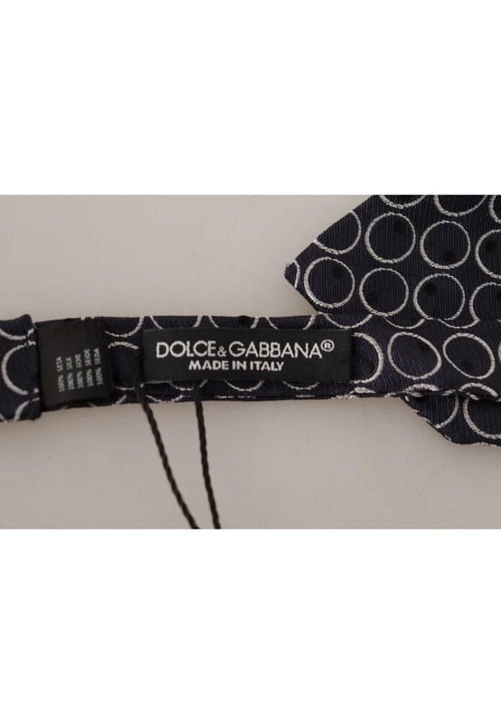 Stunning Dolce & Gabbana bow tie
  Color: Black and White Round
  Model: Tied
  Material: 100% Silk
  Adjustable length neck strap
  Made In Italy
  Width: 7cm