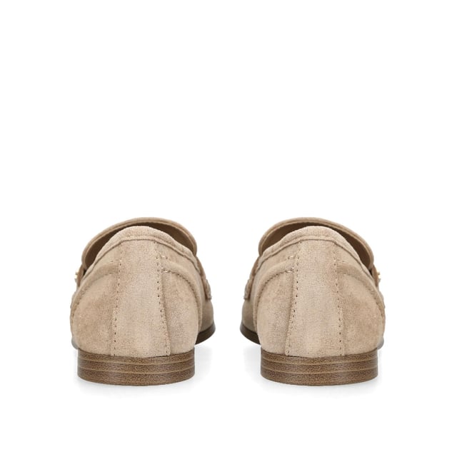 The KG Kurt Geiger Madeline is a taupe microsuede slip on loafer. There is an antiqued brass horse bit chain across the toe and small KG Kurt Geiger stud.