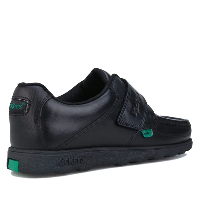 Junior Boys Kickers Fragma Strap Leather Shoe in black.- Moccasin style upper.- Touch and close double fastener. - Padded ankle collar. - Signature green logo tabs.- Kickers branding to the top strap.- Stitched detail.- Durable rubber outsole.- Leather upper  Textile lining  Synthetic sole. - Ref: 114863