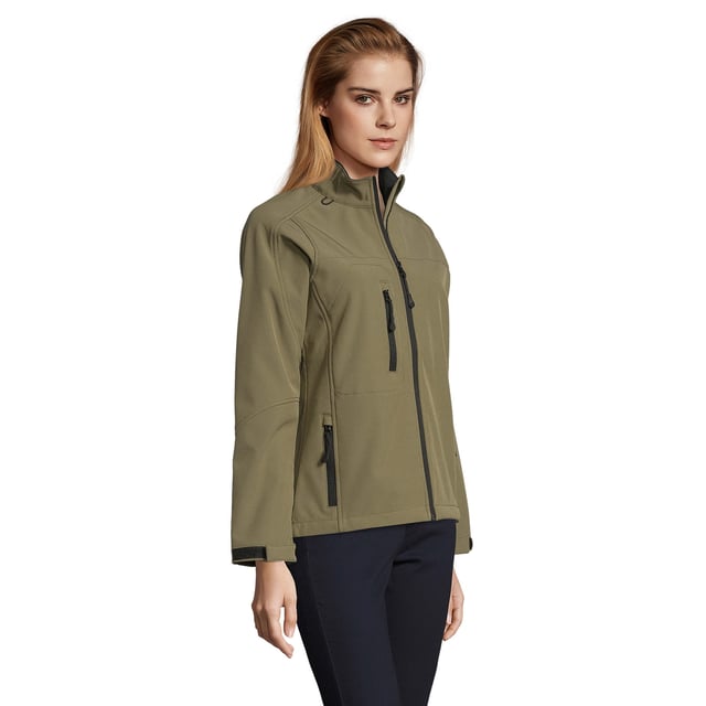 Stretch soft shell fabric has an elastane outer membrane with polyester fleece backing. Mesh lined front body panels. Breathable, windproof and water resistant. Shaped fit with taped neck. Collar high full zip with inner storm flap and chin guard. Two front zip pockets and one right chest zip pocket. Tear release adjustable cuffs. Adjustable drawcord at hem. Drop tail. Access for decoration. Material: 96% polyester/ 4% elastane outer. Ladies size: S(8/10), M(12), L(14), XL(16), XXL(18).