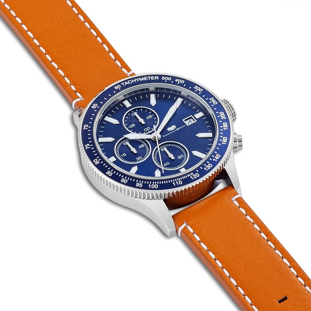 GENERAL INFORMATION:  • Targetgroup: Male  • Wristwatch: Chronograph  • Display: analogue  • Weight of watch w/o box (gr.) - approx.: 79,0  • model series: Karthago II  MOVEMENT:  • Movement: Quartz  • Term of Movement: VD57  • Origin of movement: Japan  BRACELET:  • Material of bracelet/strap: Genuine leather  • Plating of bracelet/strap: None  • Finishing of bracelet/strap: Smooth  • Finishing/Decoration of bracelet/strap: Contrast stitching  • Clasp/Closure/Buckle: Buckle  • Color of bracelet/strap: Brown  • Length of bracelet/strap (mm) approx.: 210,0  • Width of bracelet/strap (mm) approx.: 20,3  • Style/Design of bracelet/strap: No imprint  • Bracelet/strap adjustable?: No  CASE:  • Shape of case: Round  • Size/Diameter of case in mm . approx.: 43  • Height of case in mm: 12,0  • Case material: Stainless steel  • Surface of case: Polished  • Bezel/Topring: Turnable  • Finishing/Decoration of case: Grooved  • Material of case back: Stainless steel  • Lock of case back: Screwed  • Color of case: Silver  • Coating/Plating (Case): None  • Type/Form of crystal: Flat  • Material of crystal: Mineral crystal  • Water resistant (ATM): 10  DIAL:  • Size jewelry care cloth: Date/Hour/Minute/Second/Stopwatch  • Indices: Line indices  • Material of dial: Brass  • Structure/pattern of dial: Multi-layer  • Color of dial: Blue  PUSHER, CROWN, HAND:  • Pusher: No screwed-in crown  • Corrector: Yes  • Crown: No screwed-in crown  • Type of hands: Arrow hand  • Luminescent (hands): Yes  PACKAGING & SCOPE OF DELIVERY:  • Box: Yes  • Service booklet: Yes  • Manual: Yes