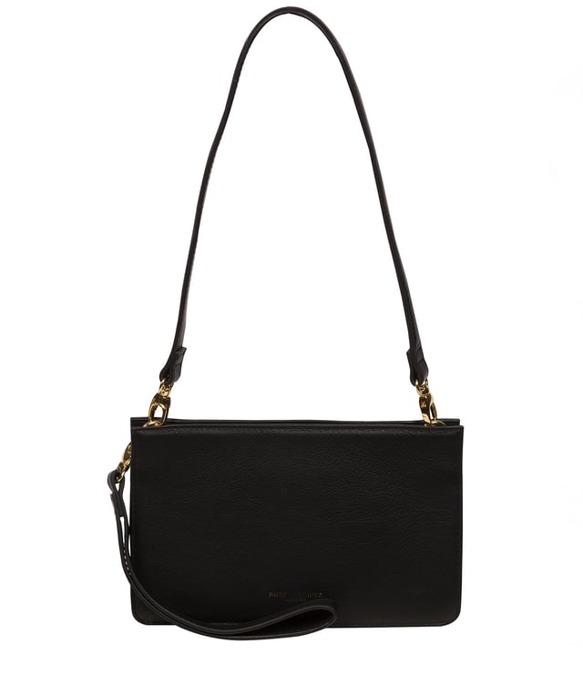 The 'Layla' grab clutch bag from the Pure Luxuries Marylebone Collection is handcrafted from high-quality, genuine Nappa leather with a natural super-soft touch. Concealed magnetic closures secure the open-top and feature a 100% cotton-lined interior, including two card slots. Comes with a detachable leather shoulder strap and a detachable leather wrist strap for different carrying options. Transform this bag into a clutch by removing the straps. Furnished with gold-coloured metal fittings and zips. The minimalist Pure Luxuries logo is embossed in gold foil for a beautifully simple finishing touch.